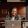 man sits with a drink in front of an open laptop in local restaurant