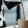 a person pouring a carafe of coffee into a cup