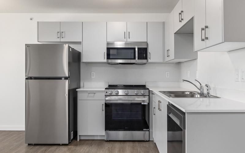 a kitchen with white cabinets